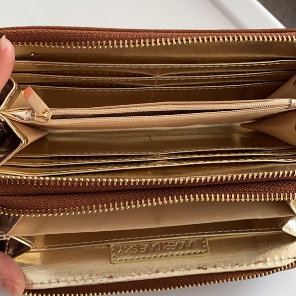 Under One Sky wristlet 8”x4”x1.5”. Caramel brown with floral embellishments. - Picture 2 of 6